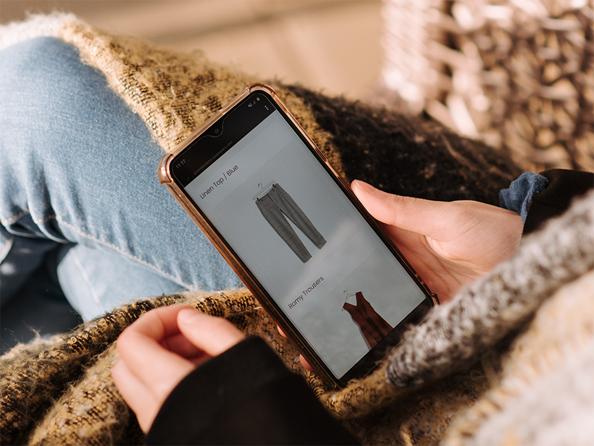 An online shopper browses clothing on a smartphone. Photo: Anete Lusina/ Pexels.