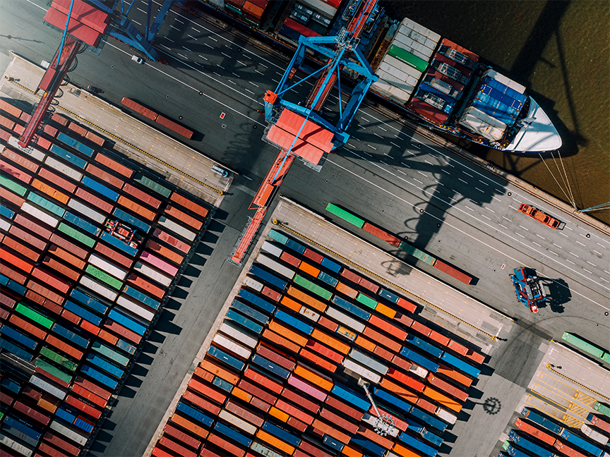 Rows of shipping containers at a cargo port. Photo: Getty Images.