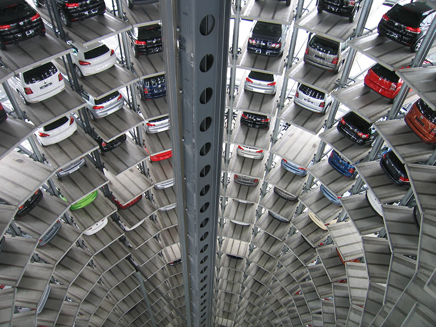 Rows of cars are parked inside a high-rise garage. Photo: Pixabay/ Pexels.