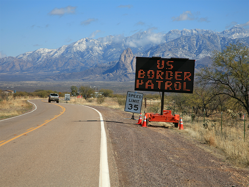 A road sign reads 'U.S. Border Patrol' near the U.S.-Mexico border in Arizona. Photo: Getty.