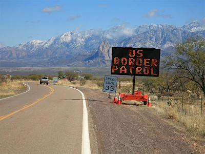 A road sign reads 'U.S. Border Patrol' near the U.S.-Mexico border in Arizona. Photo: Getty.