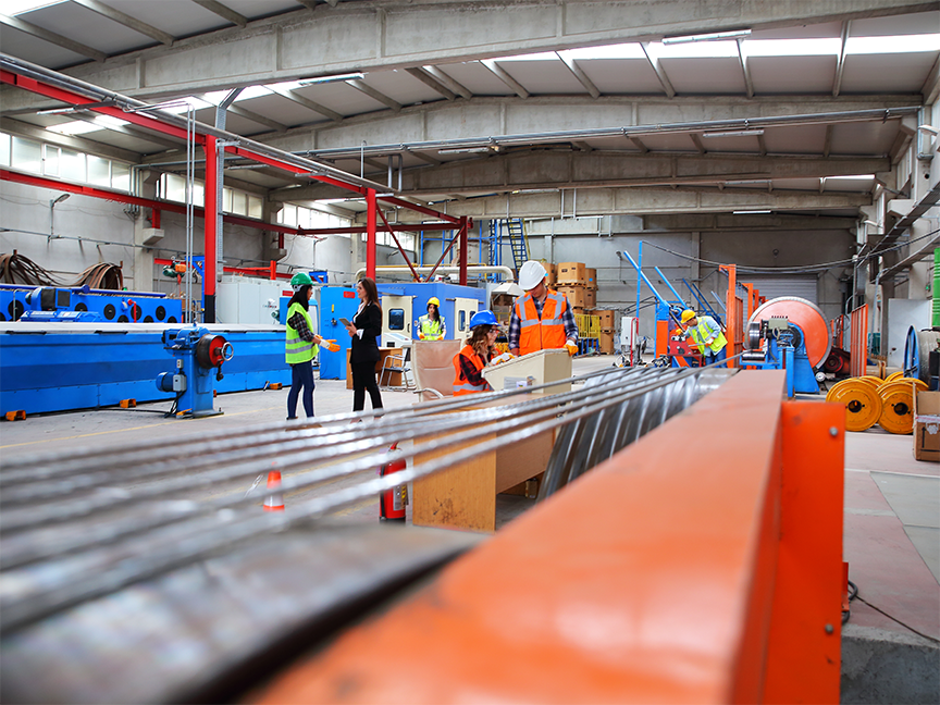 Employees are at work in an industrial factory. Photo: Getty.