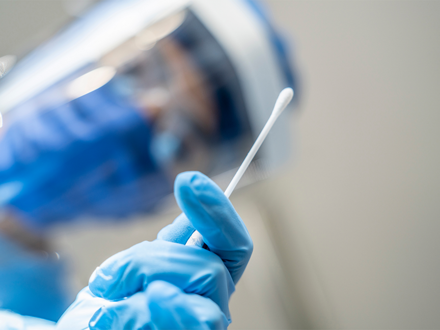 A health care professional prepares a medical swab test. Photo: Getty.