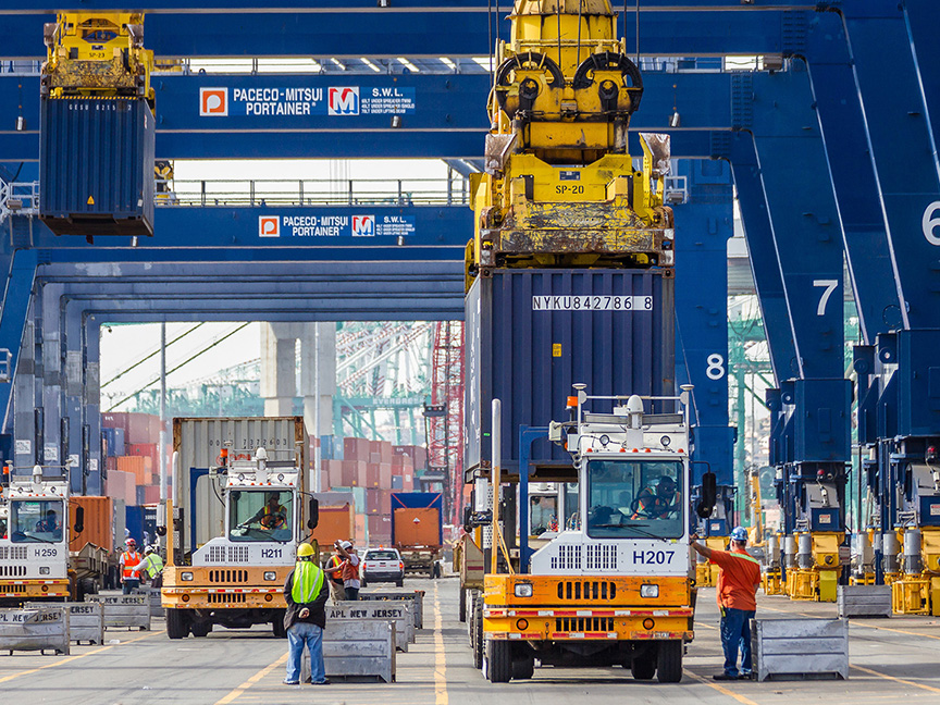 Dockworkers move cargo on a container terminal. Photo: Port of Los Angeles.