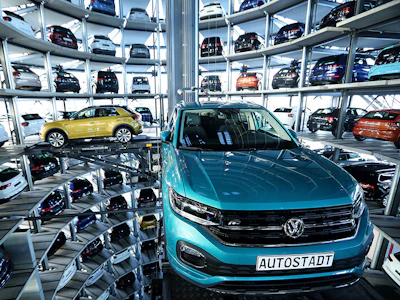Volkswagen SUVs are guided into storage bays inside one of the automaker's Autostadt delivery towers at VW headquarters in Wolfsburg, Germany. Photo: Bloomberg.