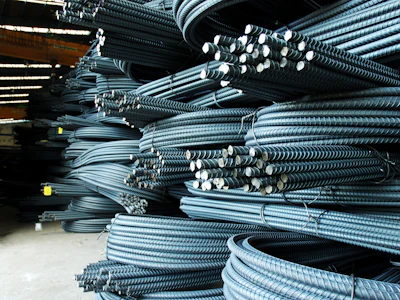 Coils and bundles of steel reinforcing bar. Photo: Shutterstock.