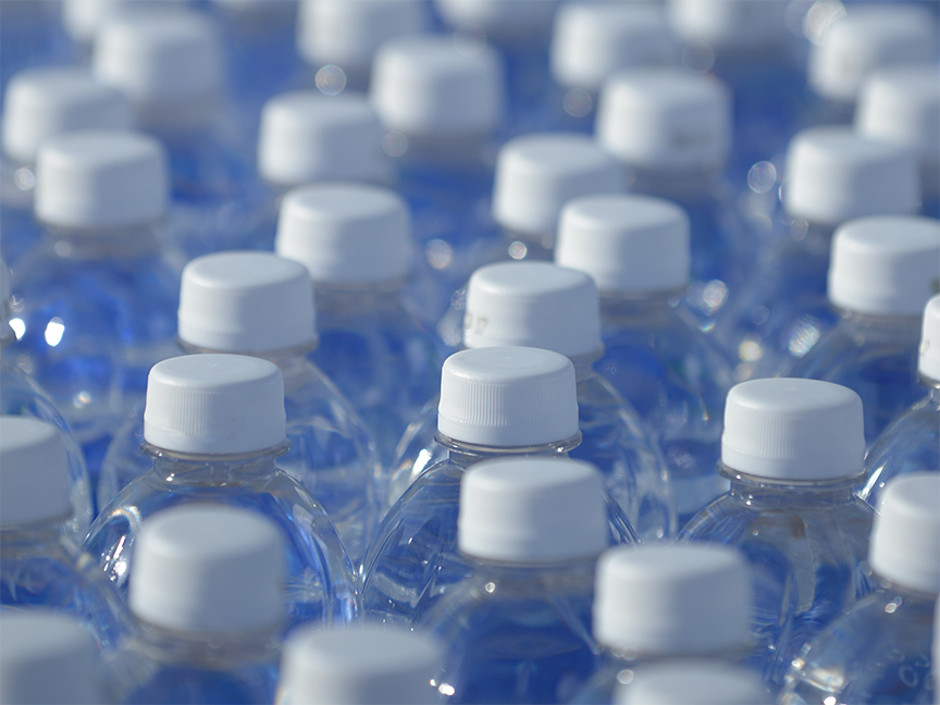 Rows of plastic water bottles. Photo: Getty.