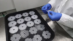 An employee trims silicone bungs, used for in vitro fertilisation (IVF). Photo: Bloomberg.