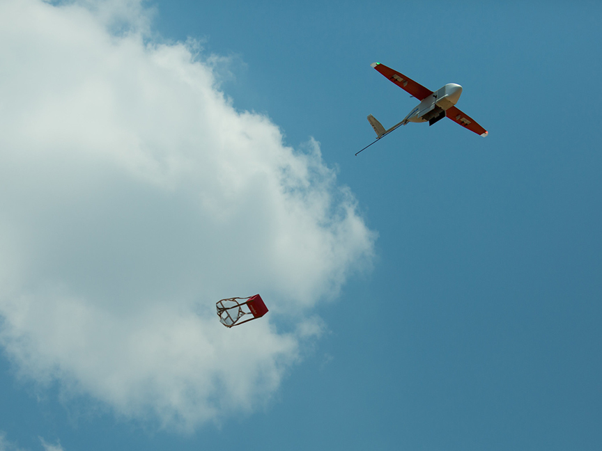A drone releases a package before landing. Photo: Paul Kagame/ flickr.