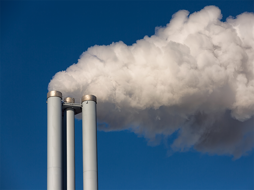 Smoke rises from cooling towers at a power station. Photo: Getty.