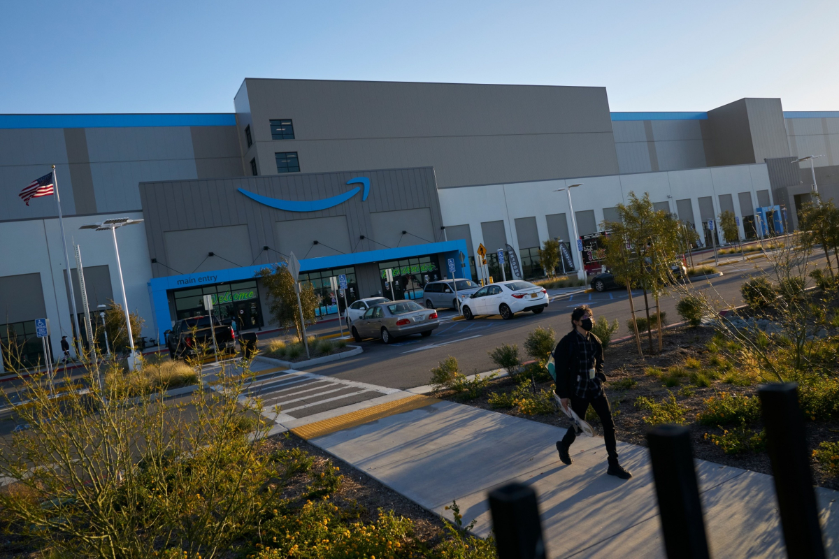An employee walks outside Amazon's SAN3 fulfillment center in the Otay Mesa neighborhood of San Diego, California. Photo: Bloomberg.