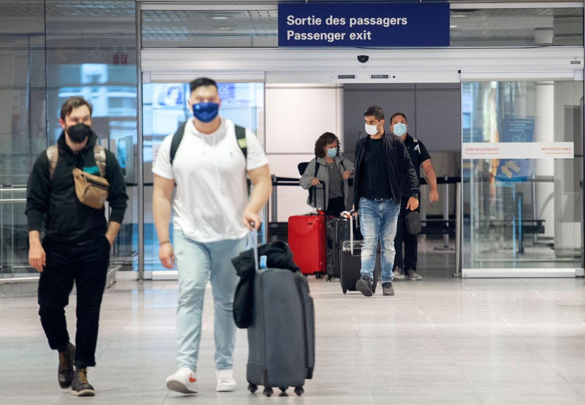 Travelers arrive at Montreal's international in April. Photo: Bloomberg