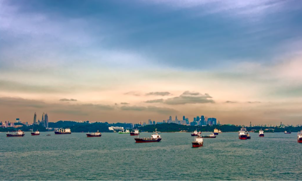 Cargo ships waiting in Singapore Harbor. Photo: iStock.com/IgorSPb
