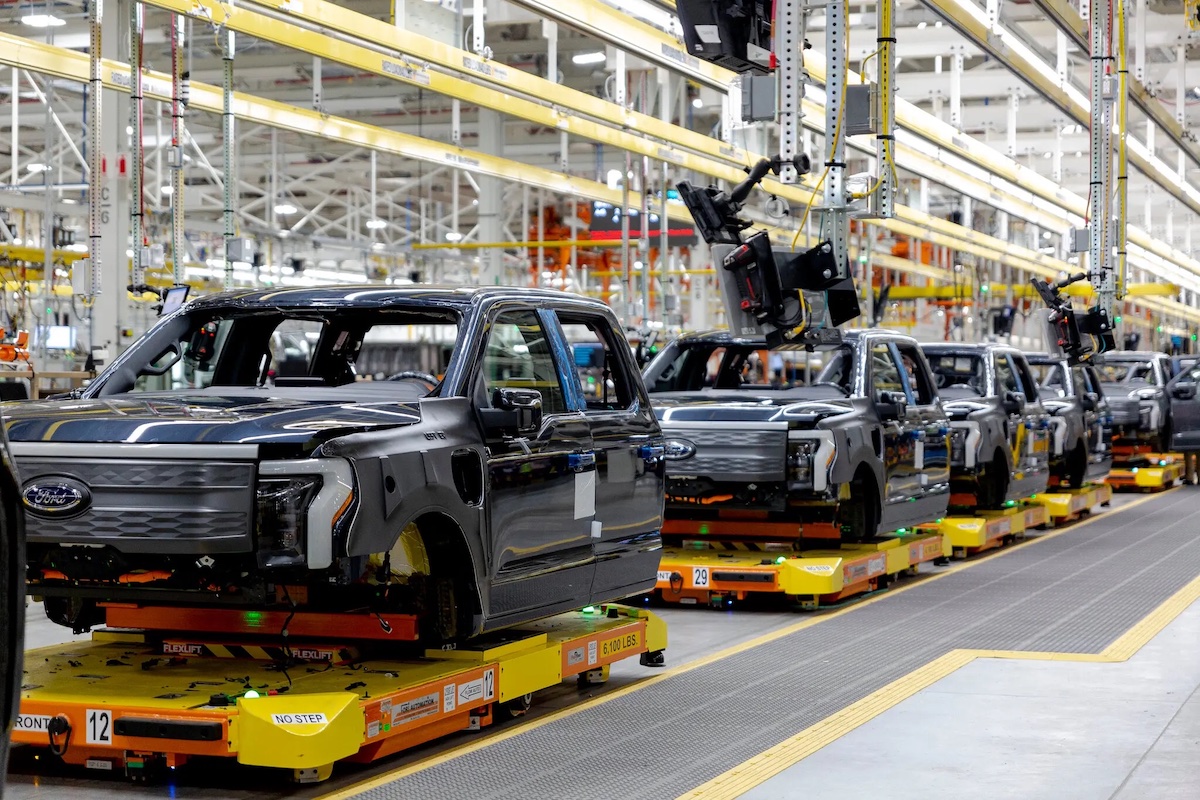 Electric Ford trucks on the factory floor.