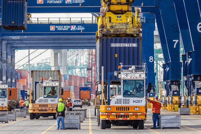 Dockworkers move cargo on a container terminal. Photo: Port of Los Angeles.