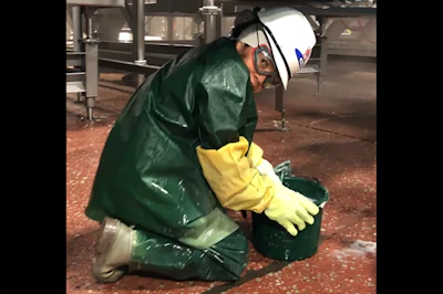 This photo, included in DoL court filings in November, 2022, shows a Packers Sanitation Services Inc. employee at the JBS Beef Plant in Grand Island, Nebraska. Photo: U.S. Department of Labor, taken by WHI Lopez