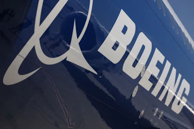 A logo on the body of a Boeing passenger aircraft.