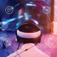 Young gamer wearing VR goggles and headset with icon VR playing and winning driver and shooter online video game on his personal computer in the room lit by neon lights, eSport network online.