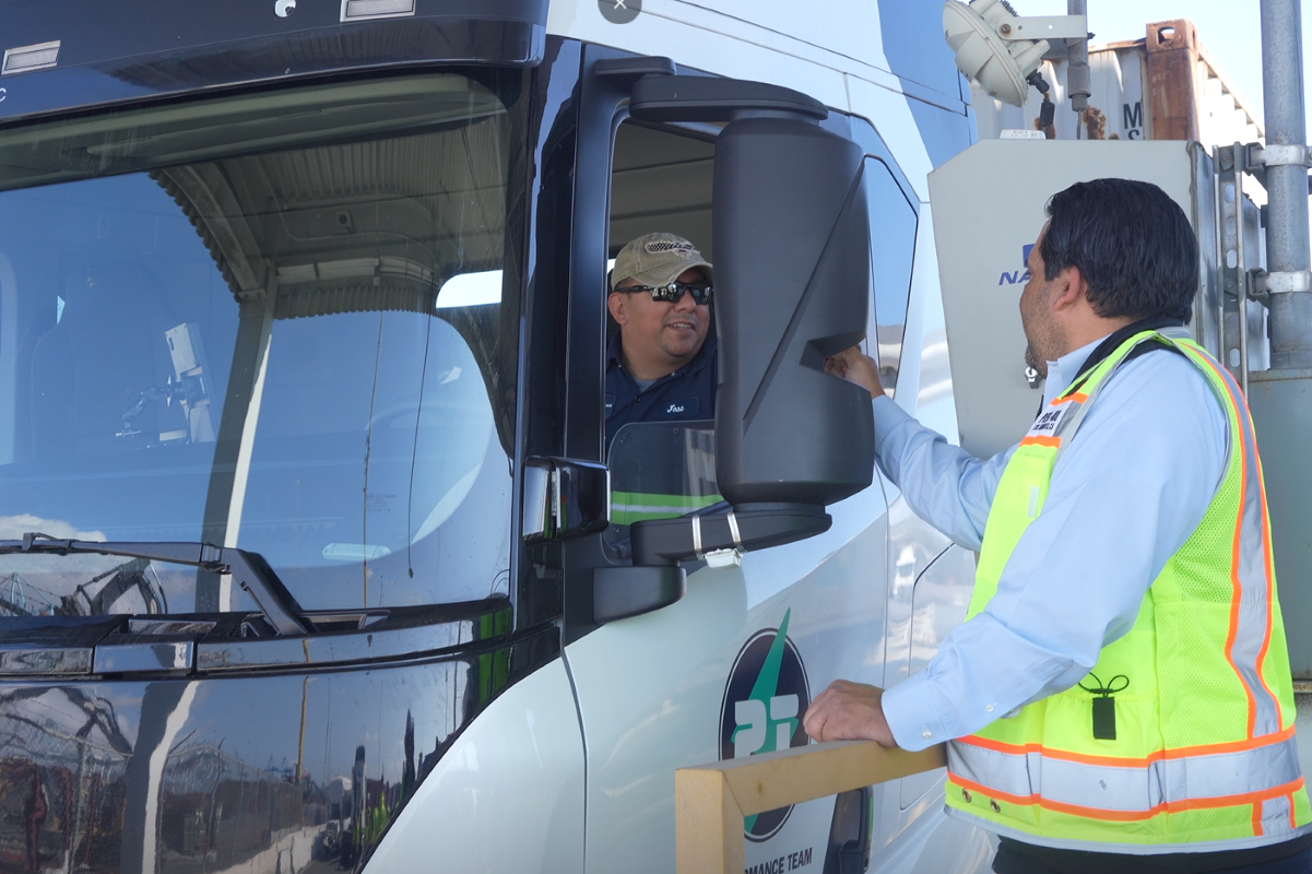 A Performance Team driver greets a Pier 400 employee during a test of Pier 400’s “Clean Truck Express” lane. Photo: APM Terminals
