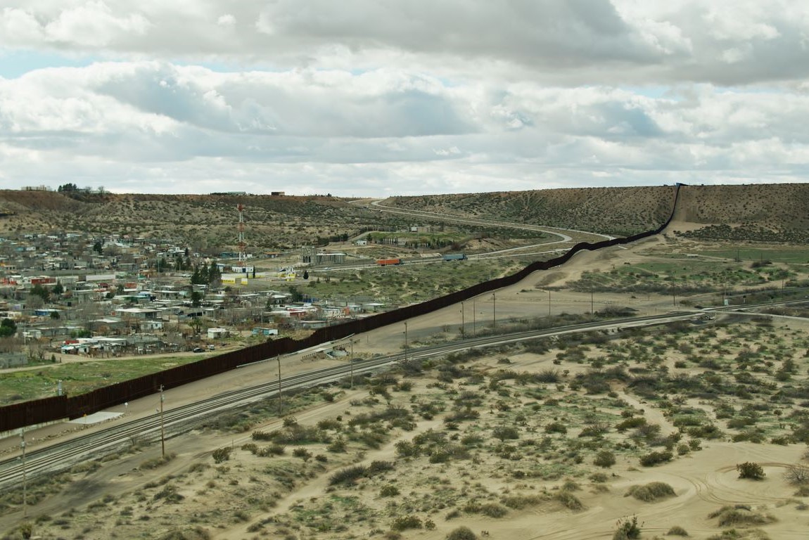 Train tracks skirt the U.S.-Mexico border wall near El Paso. Photo: iStock.com/halbergman