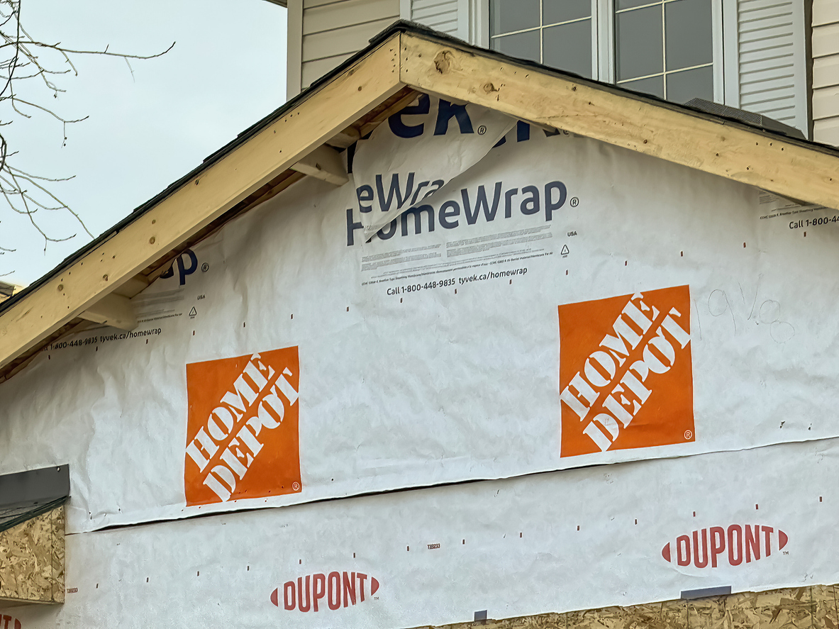 Calgary, Alberta, Canada. Dec 16, 2023. A close up to an under construction home wrap made by The Home Depot. Concept: Construction house material prices.