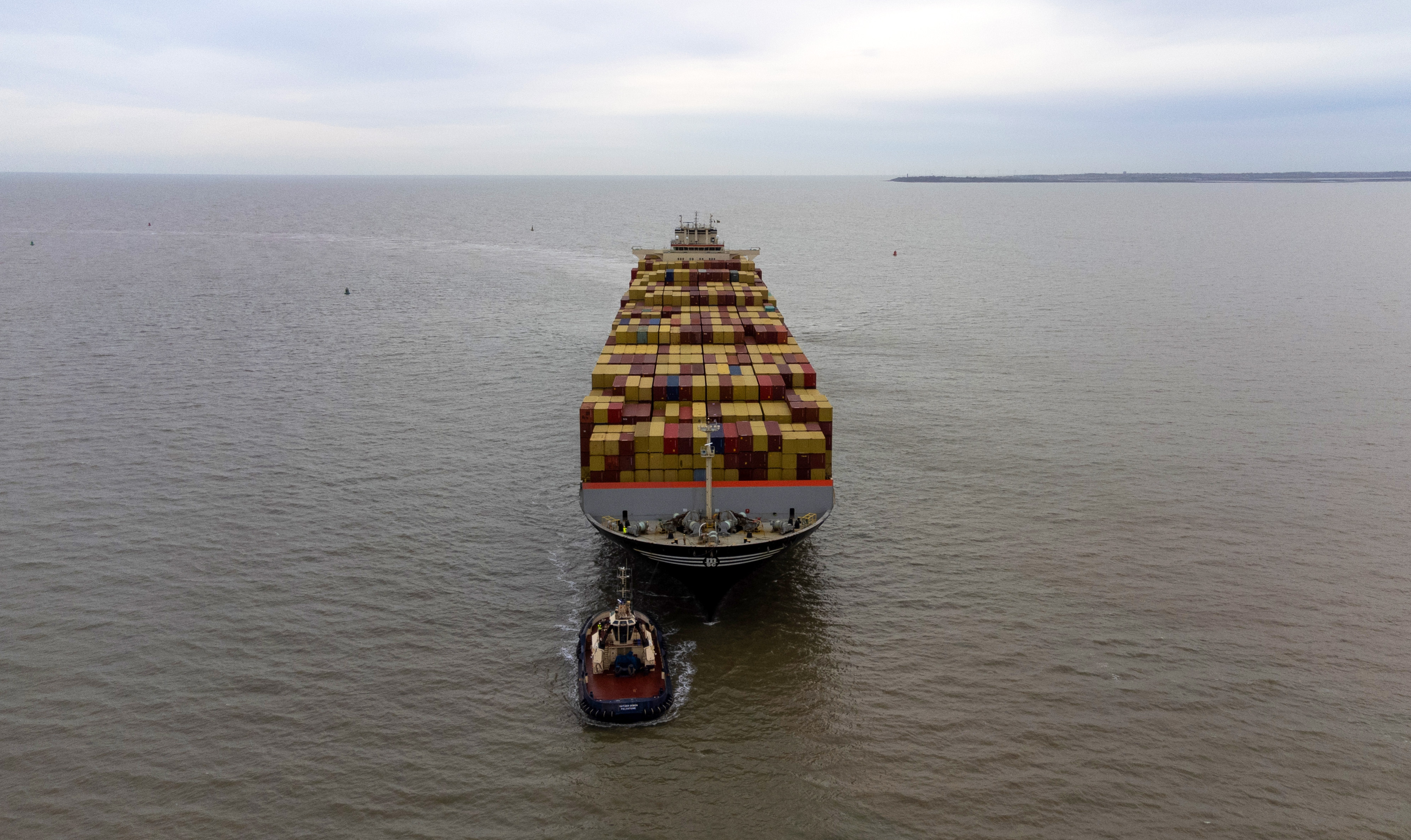 A tugboat guides the MSC Luciana container ship, left, as it approaches the Port of Felixstowe, owned by a unit of CK Hutchison Holdings Ltd., in Felixstowe, UK, on Monday, March 4, 2024. By attacking ships plying the Red Sea, Iran-backed Houthi rebels have caused the biggest disruption to global trade since the Covid-19 pandemic and provoked a military response, including US and UK airstrikes on Yemen. Photo: Chris Ratcliffe/Bloomberg
