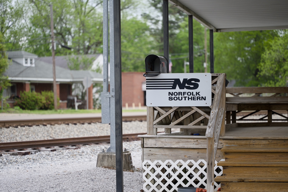 Grand Junction, Tennessee - April 29, 2023: Small Norfolk Southern sign on railing at train yard in Grand Junction, Tennessee.