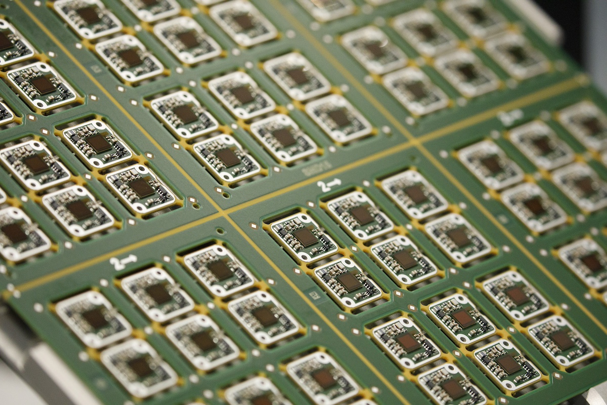 A sheet of surround view camera sensor circuits sit on the automated driving technology production line at the Continental AG automotive factory in Ingolstadt, Germany, on Friday, March 2, 2018. Nvidia Corp., forging partnerships to embed its computer technology in future autonomous cars, will work with automotive supplier Continental to put robo-taxis on the road. Photographer: Alex Kraus/Bloomberg
