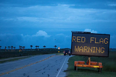 A warning sign on a North Padre Island beach access road ahead of Hurricane Beryl’s landfall in Corpus Christi, Texas. Photo: Bloomberg