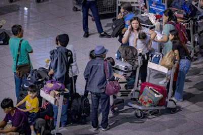 Passengers wait for check-in counters amid a global IT disruption at Ninoy Aquino International Airport on July 19. Photographer: Ezra Acayan/Getty Images