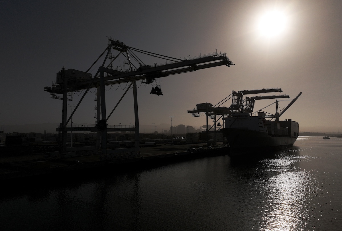 OAKLAND, CALIFORNIA - MAY 21: In an aerial view, a shipping crane sits idle at the Port of Oakland on May 21, 2024 in Oakland, California. Container shipping rates have surged nearly 30 percent as ships continue to be diverted from the Red Sea due to attacks by Iran-backed Houthi rebels. (Photo by Justin Sullivan/Getty Images)