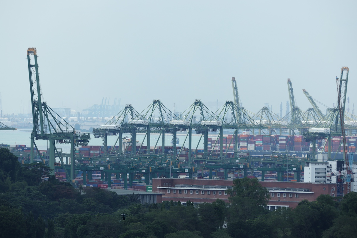 The Pasir Panjang port terminal in Singapore, on Tuesday, Jan. 3, 2023. Singapore's recovery held up in 2022, with a relatively strong year-end performance shoring up the economy ahead of an expected global slowdown this year. Photographer: Lionel Ng/Bloomberg
