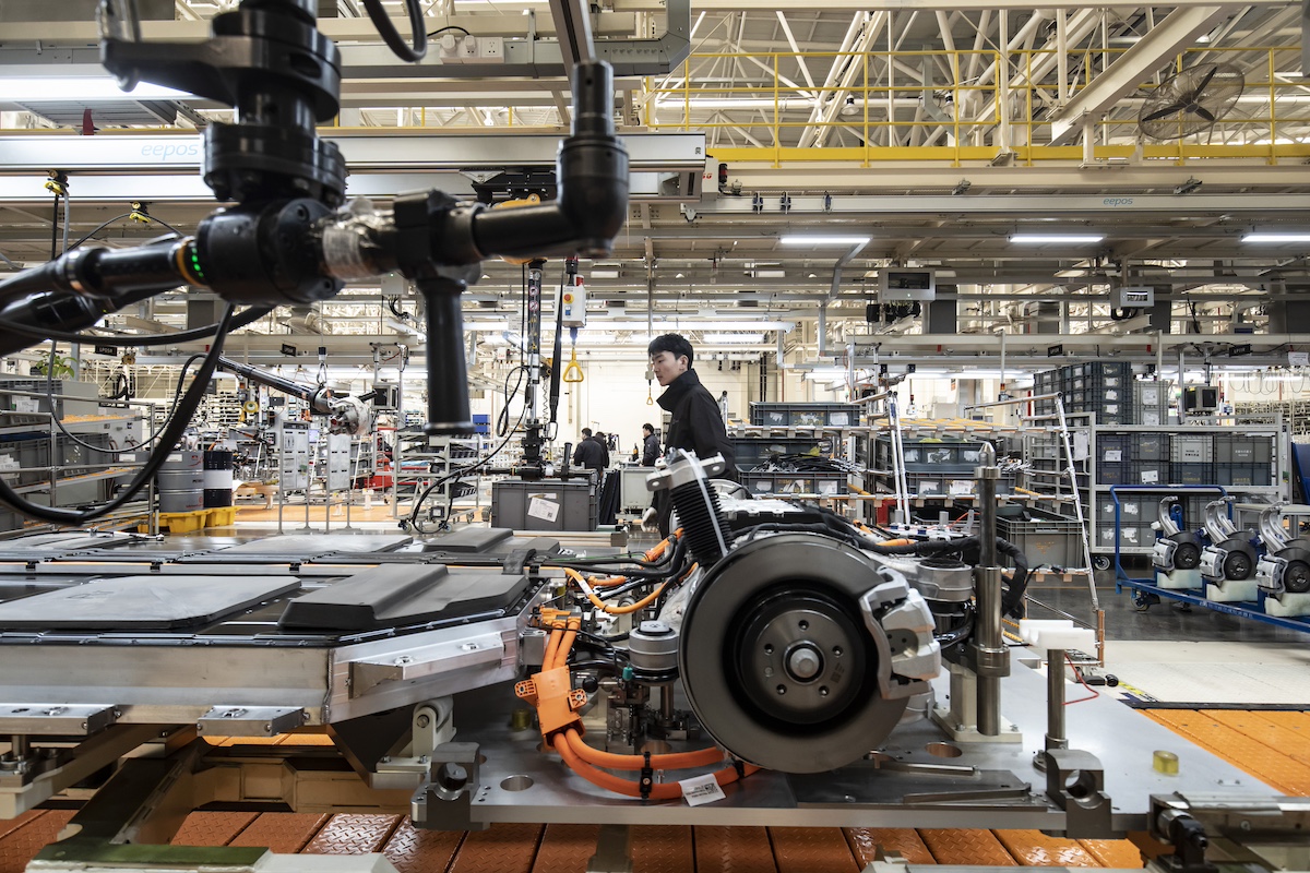 Workers on the production line of the Zeekr Co. 009 electric luxury minivan in Ningbo, Zhejiang Province, China, on Wednesday, Feb. 22, 2023. Photographer: Qilai Shen/Bloomberg