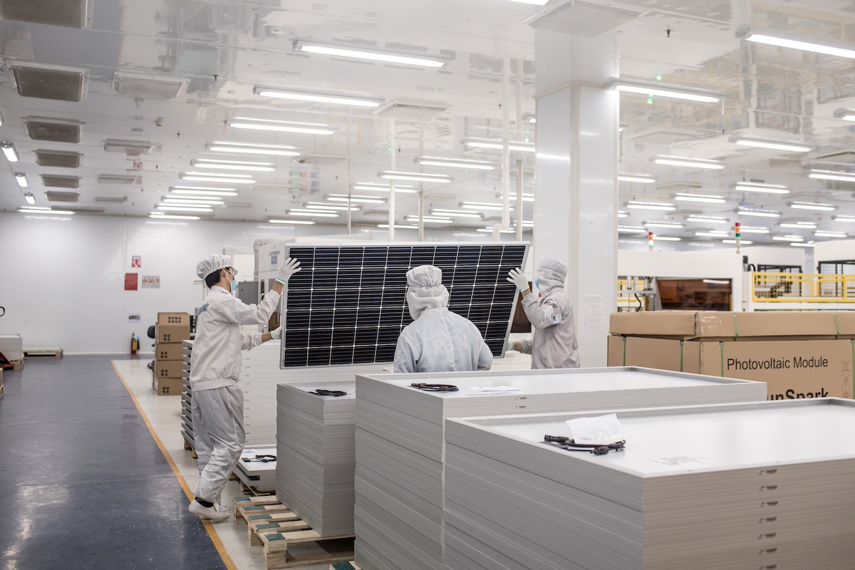 Technicians perform a final inspection of a solar panel prior to packaging at Irex Energy JSC's manufacturing facility in Vung Tau, Vietnam. Photo: Yen Duong/Bloomberg.