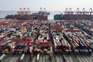 Gantry cranes and shipping containers at the Yangshan Deepwater Port in Shanghai, China. Photographer: Qilai Shen/Bloomberg