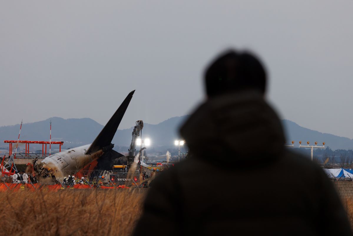 The tail of Jeju Air plane at the site of a plane fire at Muan International Airport in Muan County, South Korea, on Dec. 29. Photographer: SeongJoon Cho/Bloomberg