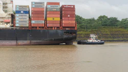 A tugboat navigates a container ship into the Culebra Cut from the Chagres River near Gamboa, Panama. Photo: Walter Hurtado/Bloomberg