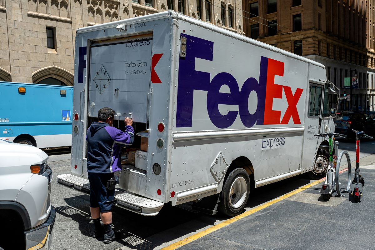 A worker opens a FedEx truck in San Francisco on June 23. Photo: Bloomberg