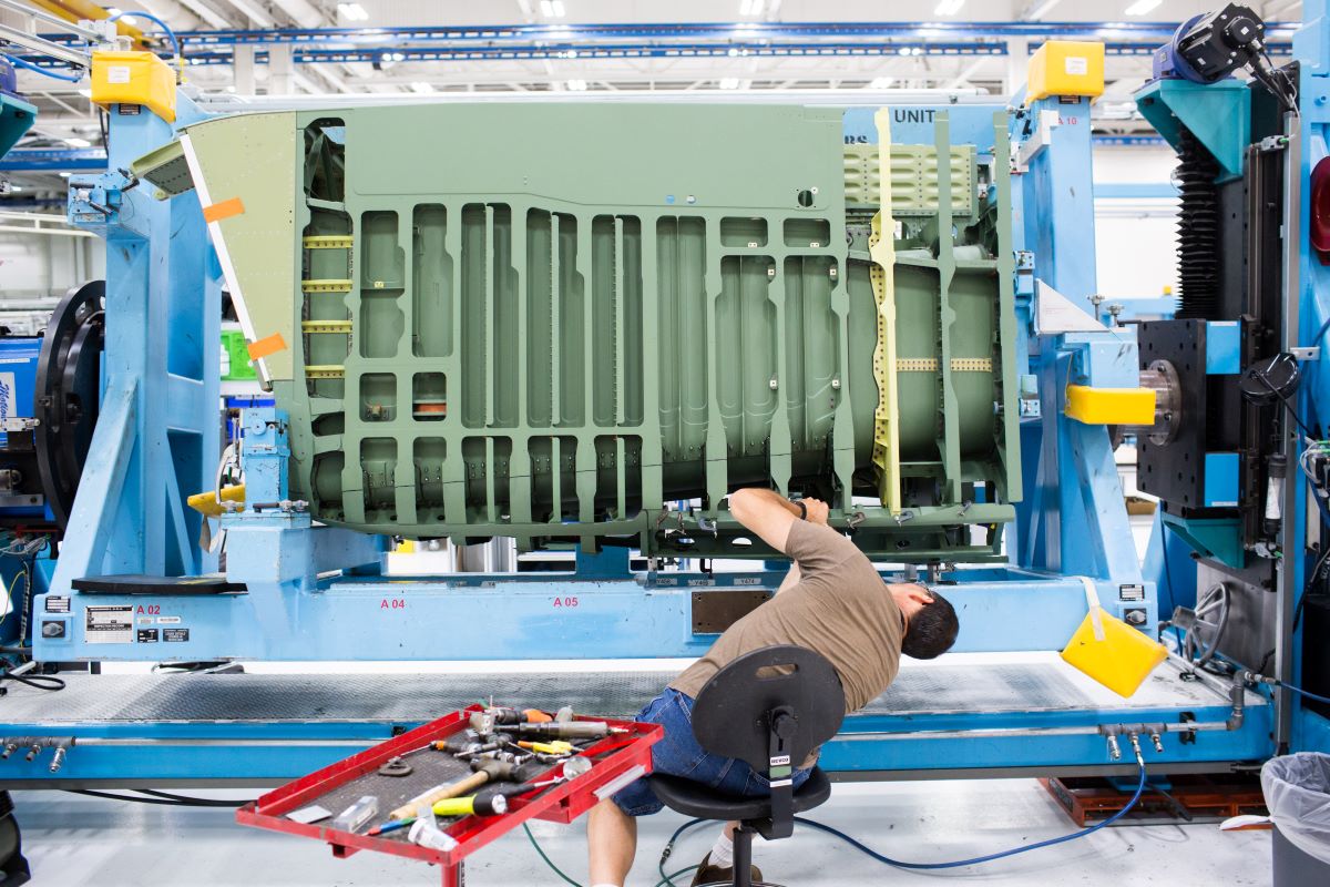 An employee works on the aft fuselage of a Boeing Co. F-15 Strike Eagle fighter aircraft at the Boeing Defense, Space & Security facility in St. Louis, Missouri. Photographer: Alex Flynn/Bloomberg