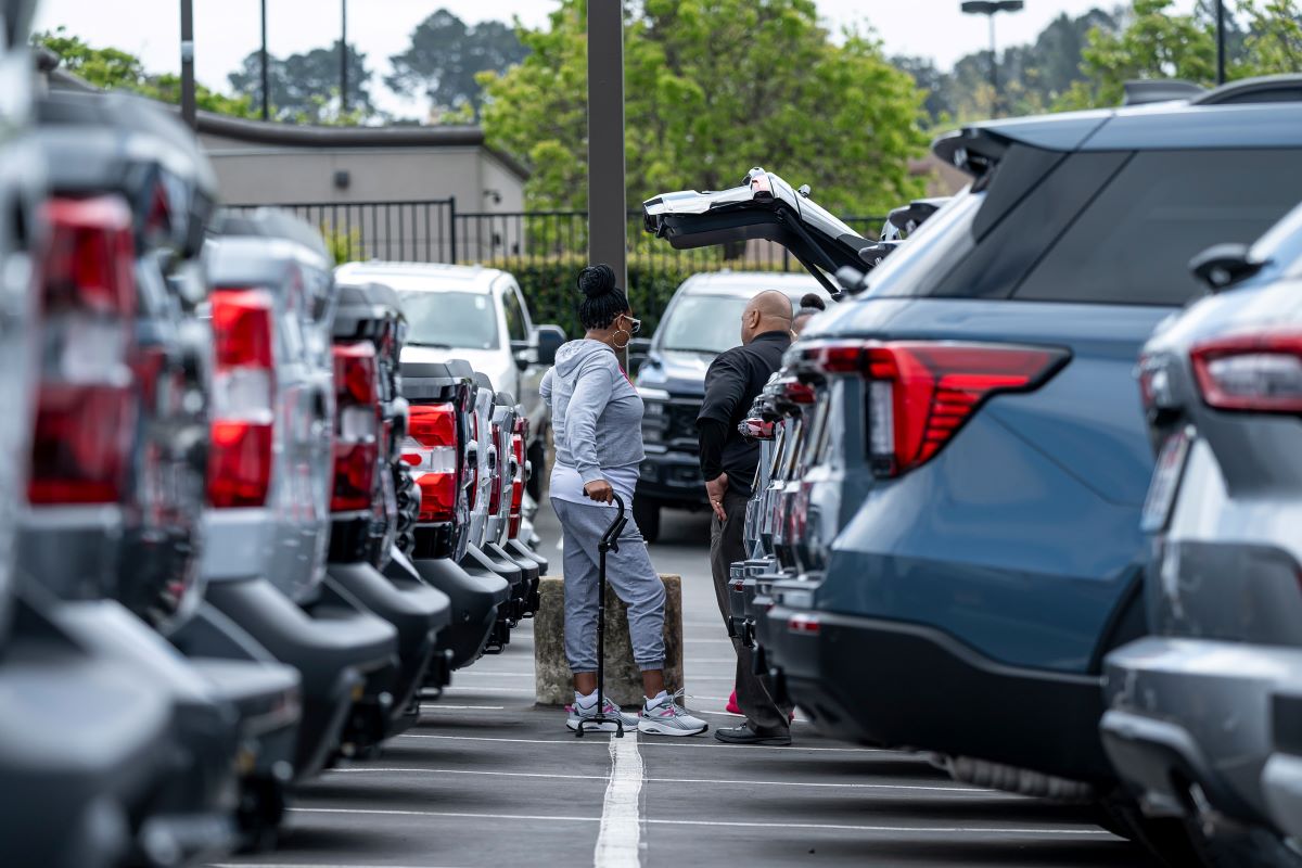 Customers at a dealership in Richmond, California. Photographer: David Paul Morris/Bloomberg