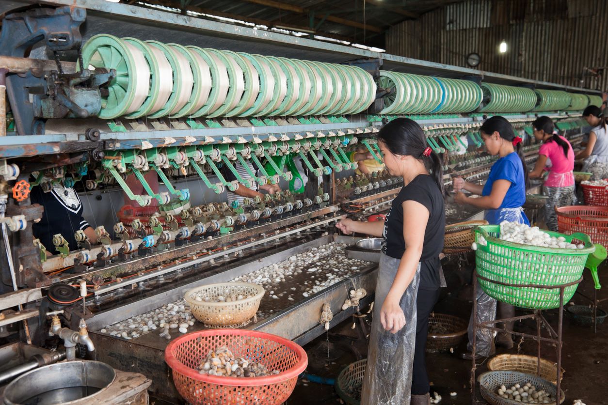 Vietnamese women working in silk factory, Dalat, Vietnam. Photo: iStock/fototrav