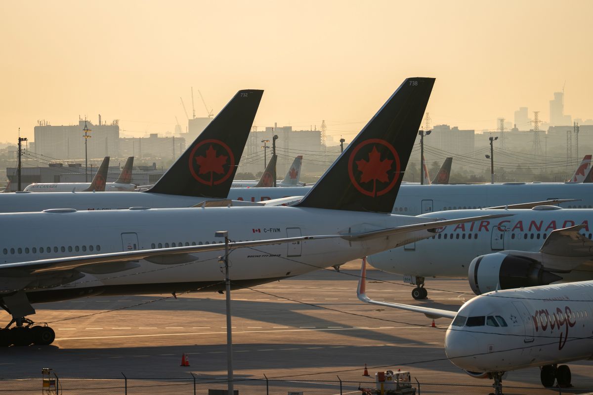 Air Canada planes at Toronto Pearson International Airport in Mississauga, Ontario. Photographer: Arlyn McAdorey/Bloomberg