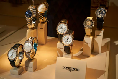 Watches in the window of a luxury store on Fifth Avenue, New York. Photographer: Bing Guan/Bloomberg