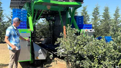 Innov8.ag CEO Steve Mantle an agtech data services and automation provider, inspects a FineField Harvy 500 being used for a late-season harvest at an Oregon blueberry farm. Photo: Courtesy of Innov8.ag.