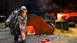 A worker collects a sample of molten steel from a blast furnace at a steel plant in Duisburg, Germany. Photographer: Alex Kraus/Bloomberg