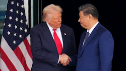 Donald Trump and Xi Jinping shake hands as they leave after their talks in Busan. Photographer: Andrew Harnik/Getty Images