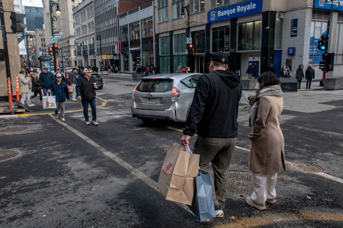 Shoppers on Sainte-Catherine Street in Montreal. Photographer: Andrej Ivanov/Bloomberg