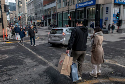 Shoppers on Sainte-Catherine Street in Montreal. Photographer: Andrej Ivanov/Bloomberg