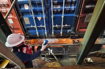 Crews, under the Unified Command, continue their response operations Nov. 25, after a fire occurred aboard a container vessel at the Port of Los Angeles. Photo: Port of Los Angeles