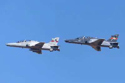 Two Royal Australian Air Force BAE Hawk 127 jet trainer aircraft taking off. Photo: iStock/Ryan Fletcher.